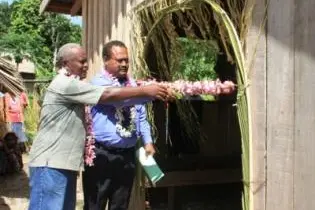 Mr Manetoali officially opening a new mini-fisheries center at Lepi village.