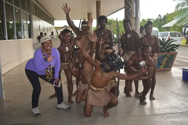 High-profile American actress and comedian Jenifer Lewis receiving a traditional Solomon Islands greeting on arrival at Honiara International Airport.