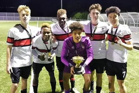 Leai and Kofana with the premiership title cup.