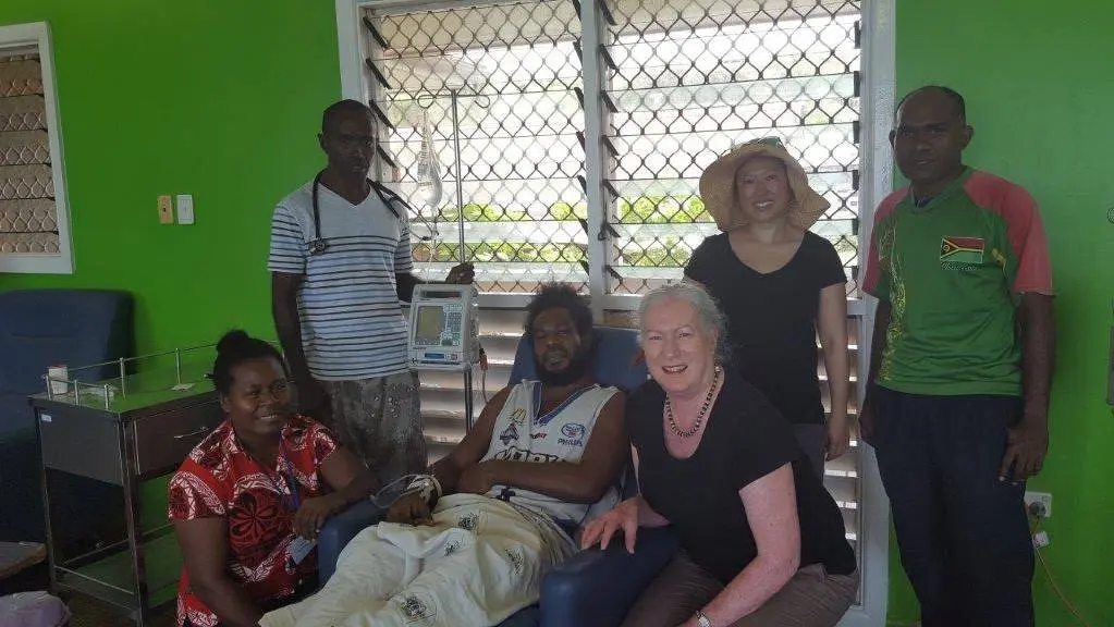 The team treating the 34-year-old patient at the hospital in Honiara, Solomon Islands. From left: nurse Meltus, Dr Andrew Soma, the patient, Wendy Spencer, Beth Hua and nurse Stephen.