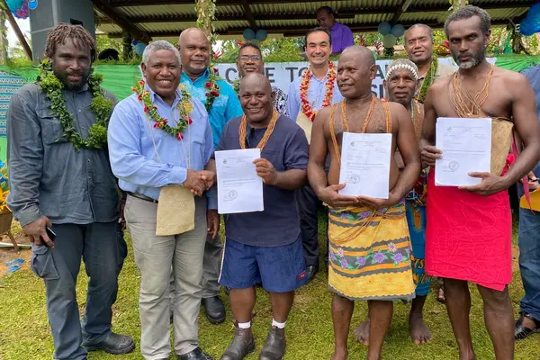 Honorable Minister for Lands, Housing and Survey (MLHS), Ishmael Avui, congratulates three landholding groups, including the Rarirahuta, Paehusi and Huniharu of East Are’ Are, for receiving their certificates of completion of the Customary Land Recording process under the Customary Land Recording Act.