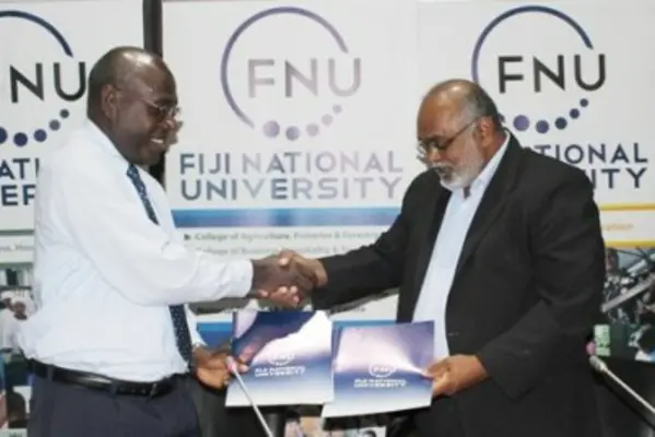 SINU Vice Chacellor Dr Glynn Galo shakes hand with FNU Vice Chacellor Dr Ganesh Chand.