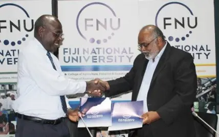 SINU Vice Chacellor Dr Glynn Galo shakes hand with FNU Vice Chacellor Dr Ganesh Chand.