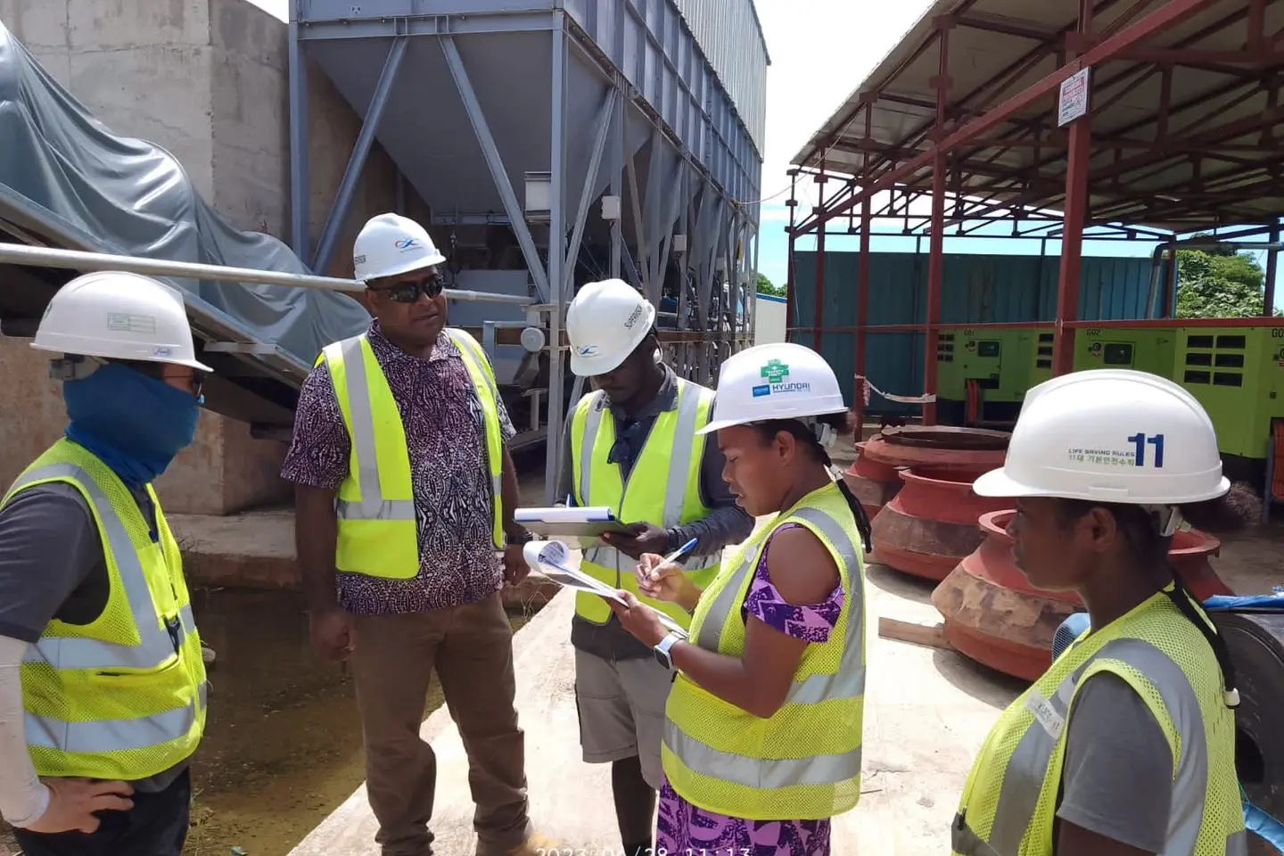 Two female Environment and Biodiversity officers of HEC actively participating in a site inspection.