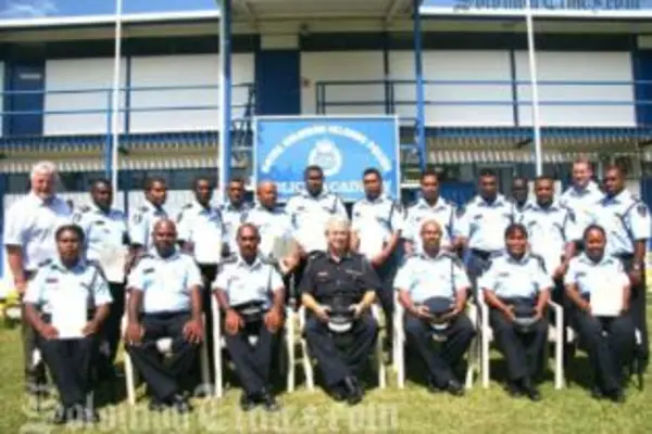 Police Commissioner Peter Marshall with the 17 newly graduated police prosecutors.