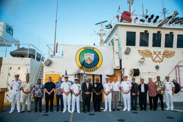 Pacific Partnership 2022 (PP22) leadership, Solomon Island leaders, and members of the international diplomatic corps in the Solomon Islands pose for a photo during the PP22 Solomon Islands closing ceremony aboard Military Sealift Command hospital ship USNS Mercy (T-AH 19).