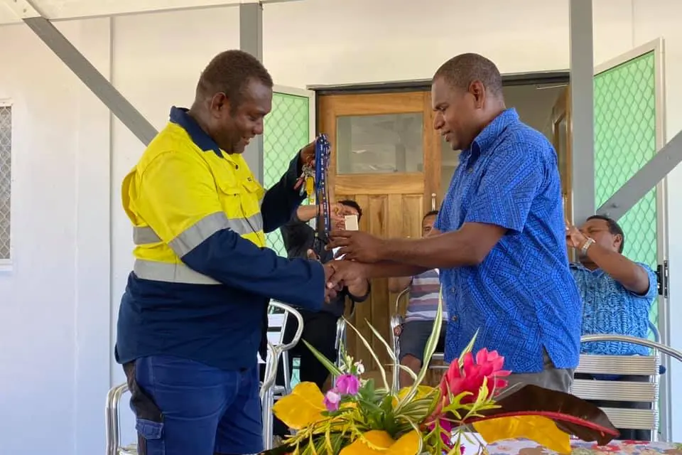 Mr Ricky George hands over keys to Mr Patterson Lusi of MFMR.