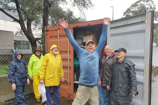Retirees in and around Sydney collect goods for schools, clinics and hospitals which are loaded into these containers.