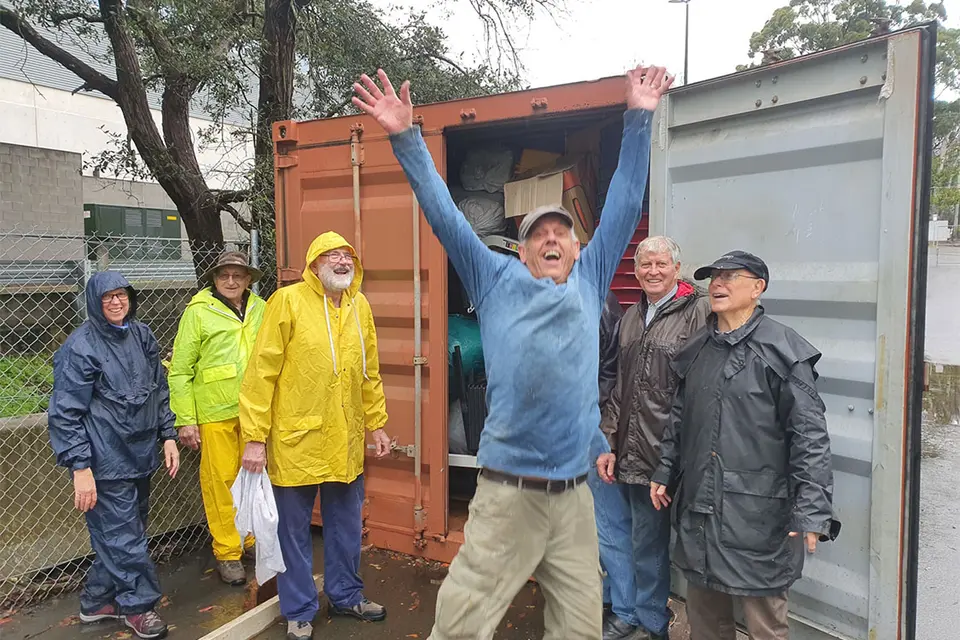 Retirees in and around Sydney collect goods for schools, clinics and hospitals which are loaded into these containers.