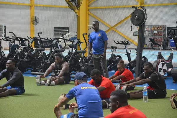 Timothy Soe assisting the boxers during their Strength & Conditioning session at SINIS.