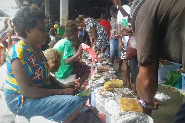 Doreen Biku selling cooked food at the central market in Honiara.