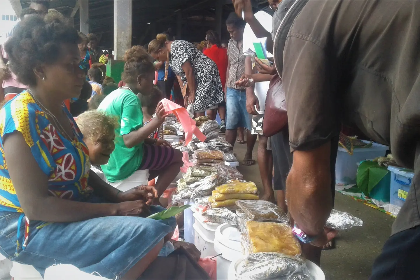 Doreen Biku selling cooked food at the central market in Honiara.