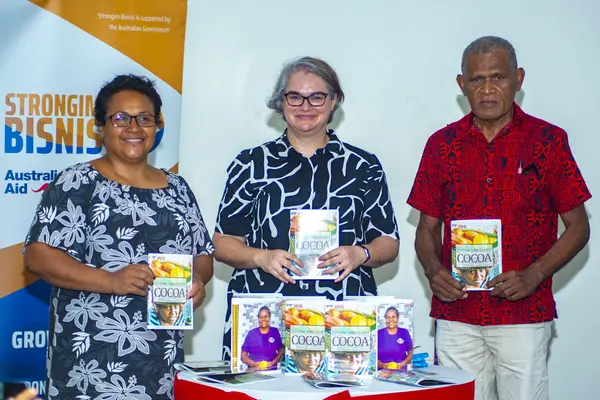 Launching the book “Mekim and Selem Cocoa”. (L to R): Permanent Secretary for the Ministry of Agriculture and Livestock, Ethel Frances; Deputy Australian High Commissioner to Solomon Islands, Sally-Anne Vincent; and Director of Solomon Islands Association of Rural Training Centres, Billy Mae.
