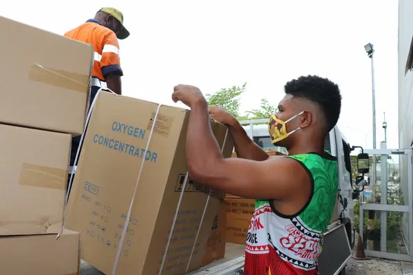 Oxygen concentrators are unloaded in April at Jacksons airport, Port Moresby, PNG.