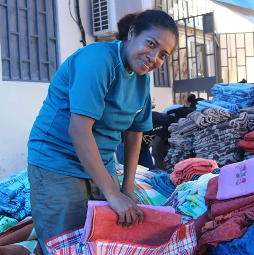 Barbara Kinsgley, ANZ staff helping to pack relief items with World Vision.