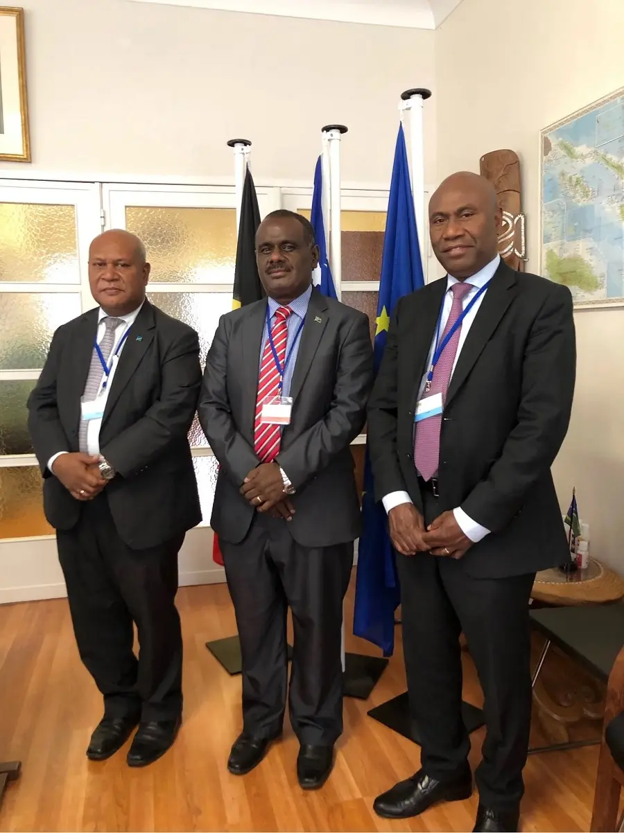 Hon. Jeremiah Manele, Minister for Foreign Affairs and External Trade [centre] at the Solomon Islands Embassy in Brussels, with Trade Commissioner Mr Joseph Ma’ahanua and Ambassador Mose.