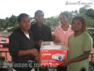 Committee members, from left to right: Marcelina Loe, Chairperson William Leguvaka, Lyn Vaike and Ben Salepo with projector for Selwyn College.