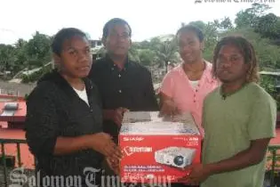 Committee members, from left to right: Marcelina Loe, Chairperson William Leguvaka, Lyn Vaike and Ben Salepo with projector for Selwyn College.