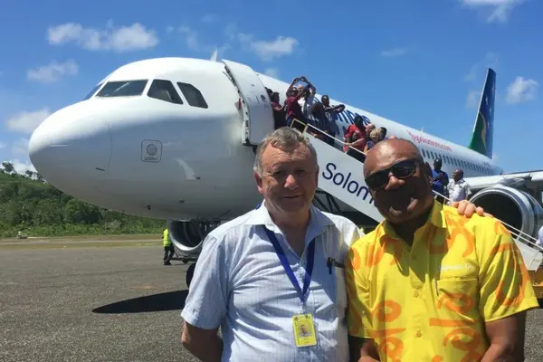 Solomon Airlines Chief Executive Brett Gebers (L) and Tourism Solomons Chief Executive Josefa Tuamoto (R) on the tarmac in Munda.