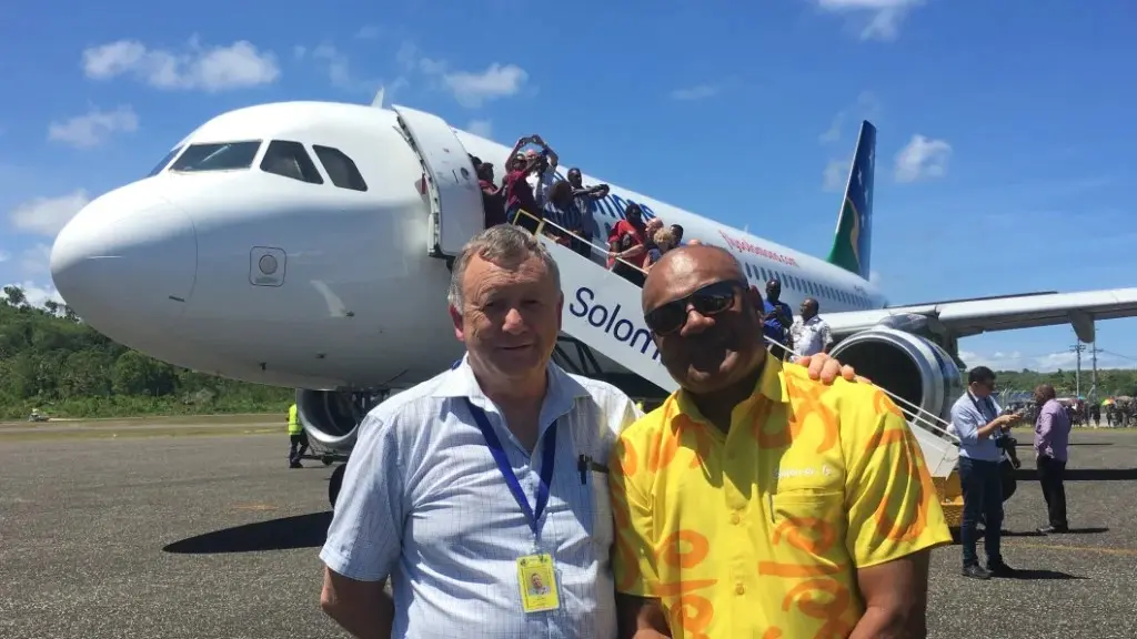 Solomon Airlines Chief Executive Brett Gebers (L) and Tourism Solomons Chief Executive Josefa Tuamoto (R) on the tarmac in Munda.