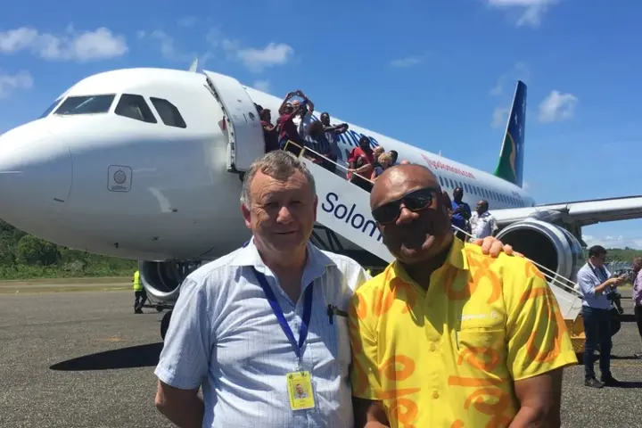 Solomon Airlines Chief Executive Brett Gebers (L) and Tourism Solomons Chief Executive Josefa Tuamoto (R) on the tarmac in Munda.