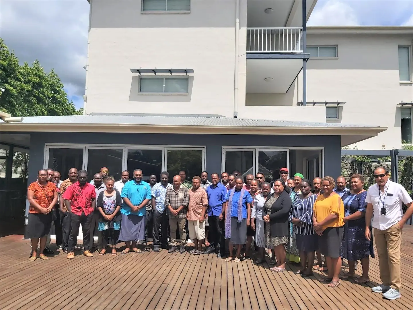 Group photo of NHEOC IC Dr Nemia Bainivalu, training facilitators including MHMS Advisor Dr Yogesh Choudhri and participants.