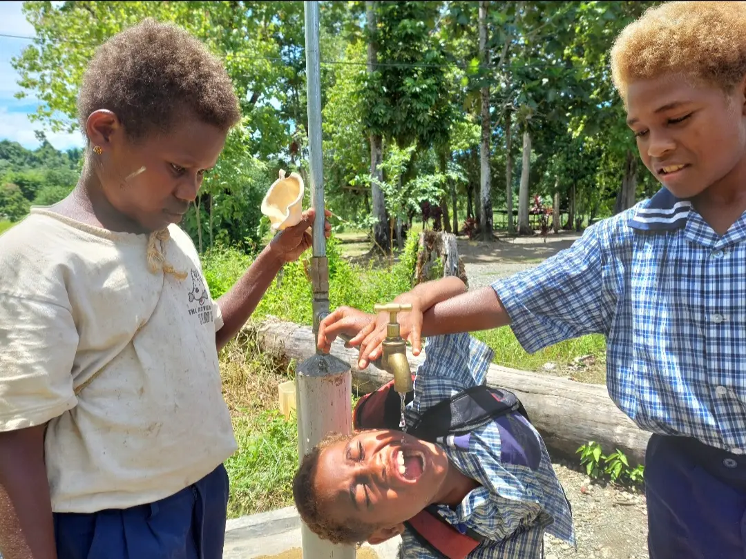 These students are now able to access safe drinking water from the school standpipe, provided by the CBSP water supply program.