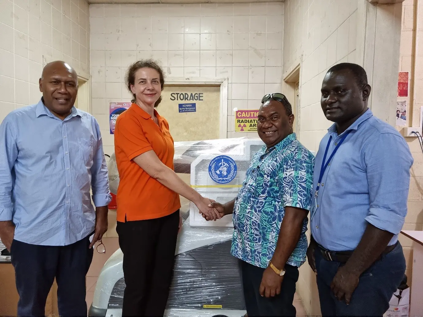 Handing over of X-ray machine by WHO OIC Dr Sonja Tanevska (centre left) to NRH Medical Superintendent, Dr John Hue.