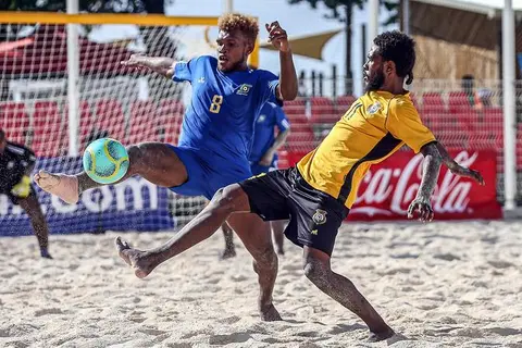 Solomon Islands Anthony Talo gets a foot to the ball ahead of Vanuatu's Loic Boulet.
