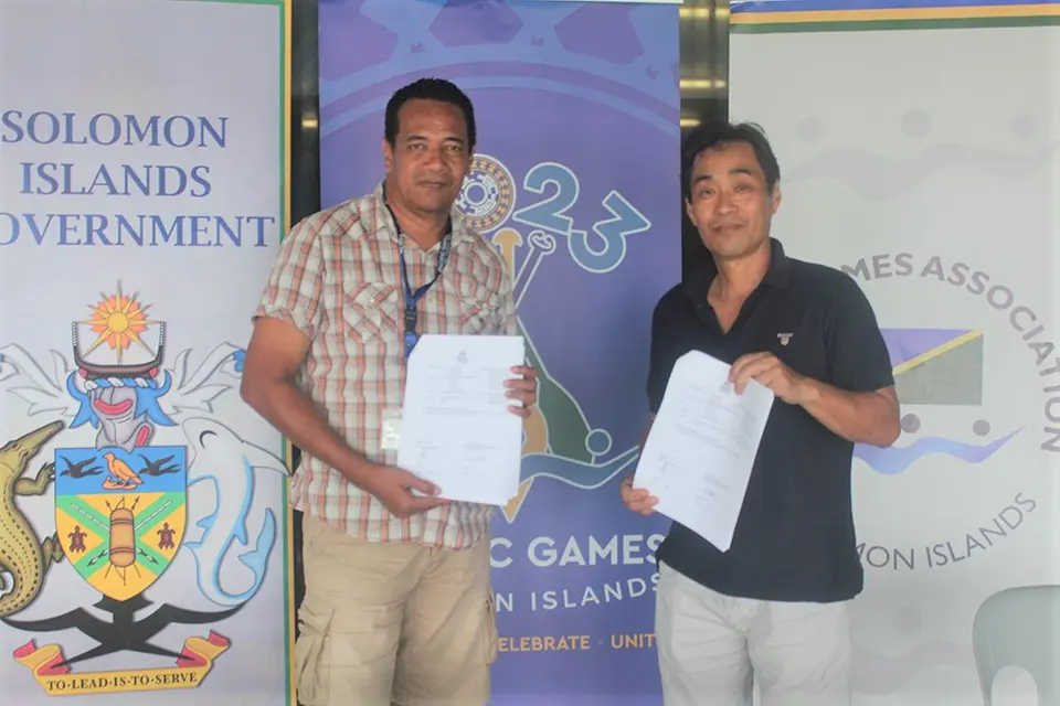 Adrian Tuhanuku, Senior Sport Delivery Manager at the 2023 Games Organizing Committee (GOC) and President of the Solomon Islands Weightlifting Federation, Naoyuki Fujiyama after signing of the first funding agreement with the GOC.