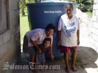 Water tanks on Aitutaki, Cook Islands, as part of a project to ensure safe drinking water for families adapting to climate change.