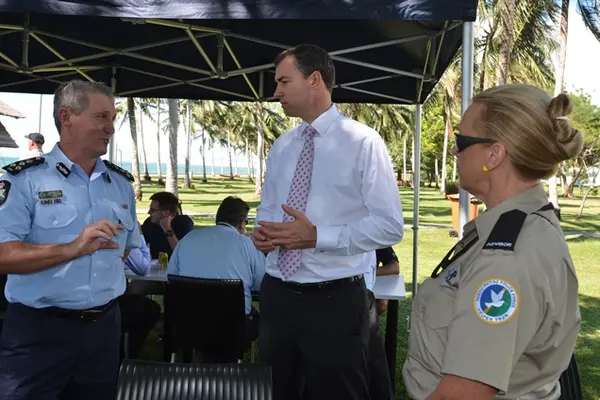 Australia's Justice Minister Keenan (c) speaking with Commander of the Participating Police Force, Greg Harrigan.