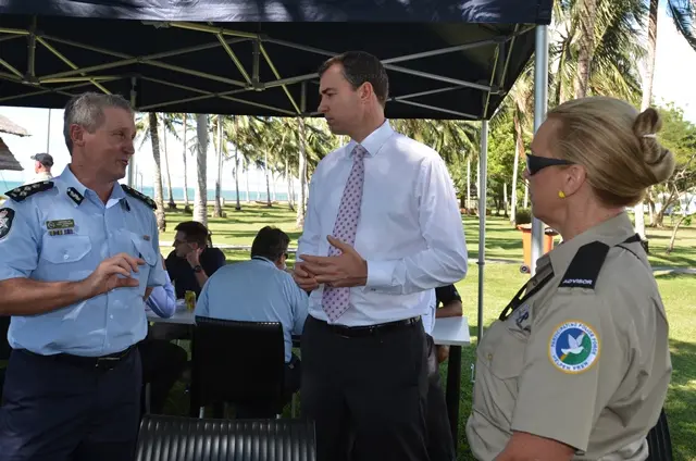 Australia's Justice Minister Keenan (c) speaking with Commander of the Participating Police Force, Greg Harrigan.