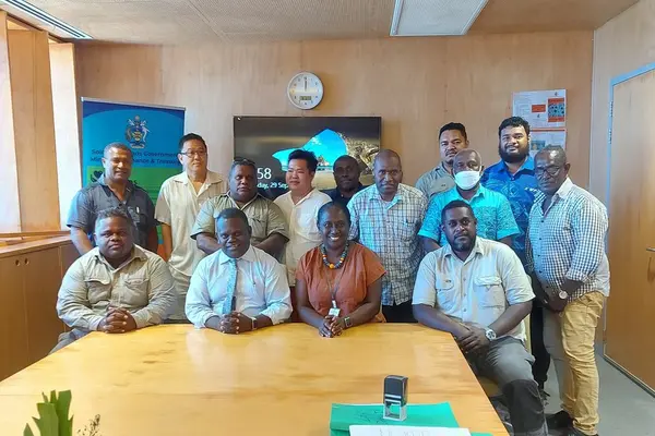 Group photo of Permanent Secretaries Finance and Treasury & Health and Medical Services with officials and the managing directors of companies that were awarded the job to construct the AHCs and RHCs.
