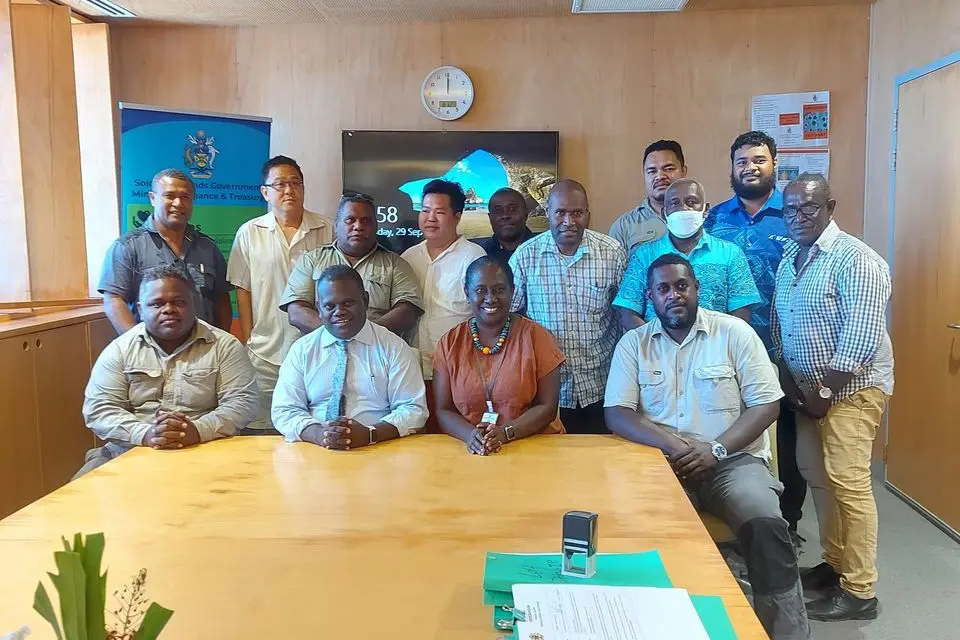 Group photo of Permanent Secretaries Finance and Treasury & Health and Medical Services with officials and the managing directors of companies that were awarded the job to construct the AHCs and RHCs.