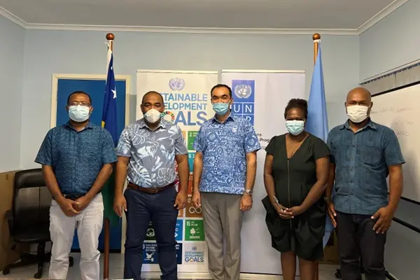 Representatives from MECDM and UNDP at an LoA Signing Ceremony.