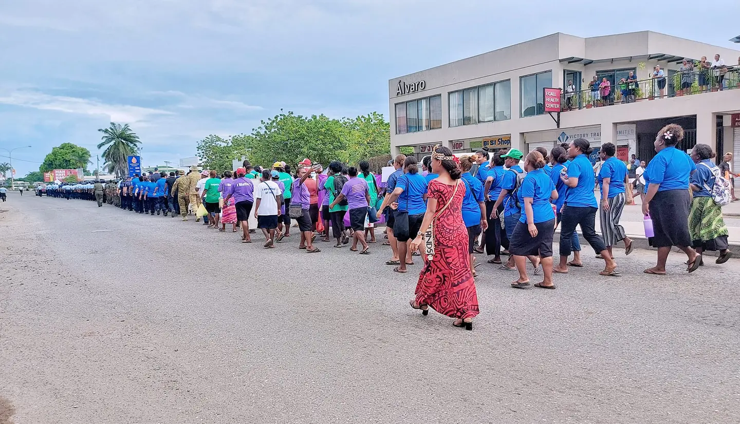 Women march through the streets of Honiara to mark International Women's Day 2023.