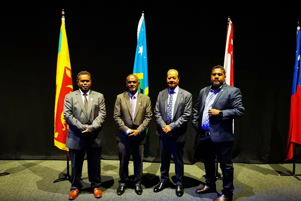 Minister of Foreign Affairs and External Trade, Hon. Jeremiah Manele (second left) at the 8th Bali Process Ministerial Conference held in Adelaide, South Australia. Here he is joined by Deputy Secretary MFAET, Cornelius Walegerea, H.E. Robert Sisilo and Solomon Islands Chamber of Commerce (SICCI) Board Chairman Ricky Fuo'o.
