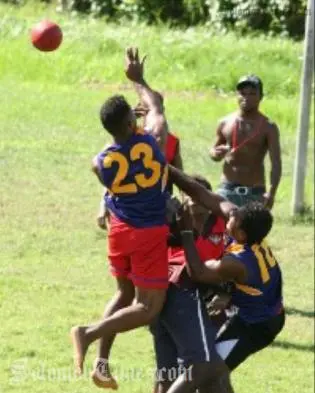 Young players engaging in the recently introduced game of Australian Football.