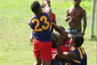 Young players engaging in the recently introduced game of Australian Football.