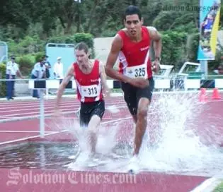 Tupuhoe Tahi and Pierre Bourret (both of Polynesie Francaise), silver and bronze medal winners in the men's 3000m steeplechase. The gold medal went to Chris Votu (Solomon Islands).