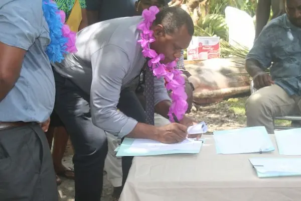 Acting Permanent Secretary Mr Ferral Lasi signing the MOU to develop Aruligo into a national aquaculture centre.