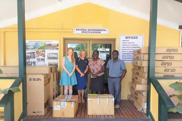 Group photo with the equipment in their boxes, (L-R) AHC COVID-19 Support Coordinator Ms. Laura Wilson, AHC Counsellor for Human Development Ms. Julie McCallum, MHMS Permanent Secretary Mrs. Pauline McNeil & MHMS Deputy Secretary Health Care Dr Gregory Jilini.