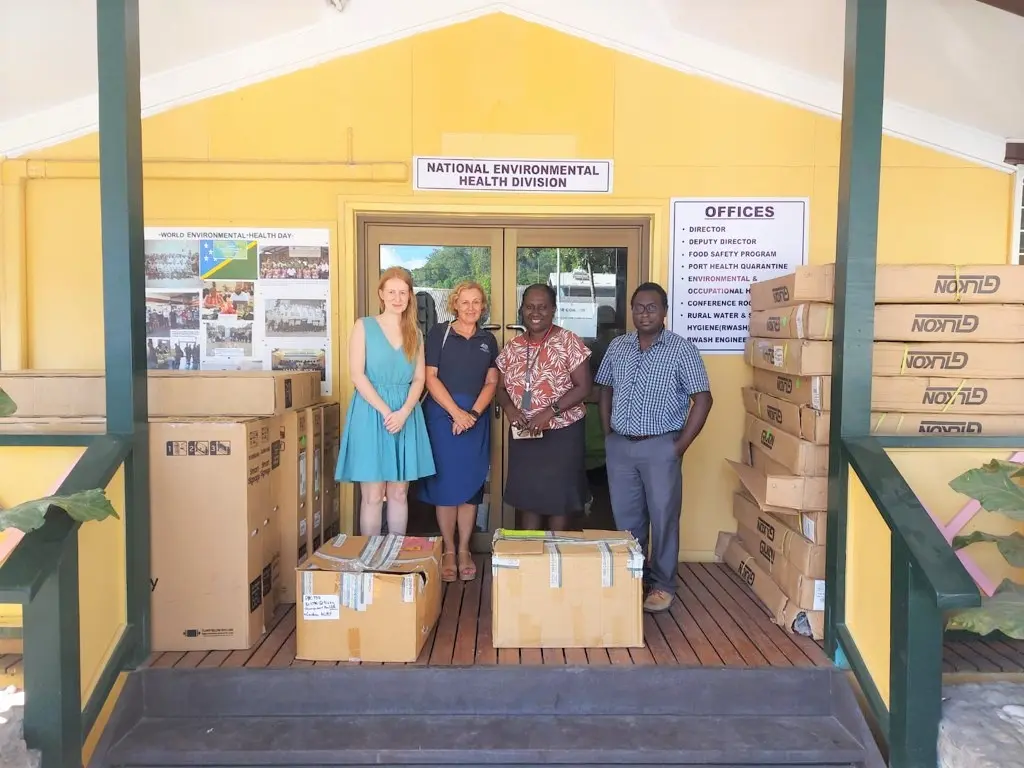Group photo with the equipment in their boxes, (L-R) AHC COVID-19 Support Coordinator Ms. Laura Wilson, AHC Counsellor for Human Development Ms. Julie McCallum, MHMS Permanent Secretary Mrs. Pauline McNeil & MHMS Deputy Secretary Health Care Dr Gregory Jilini.