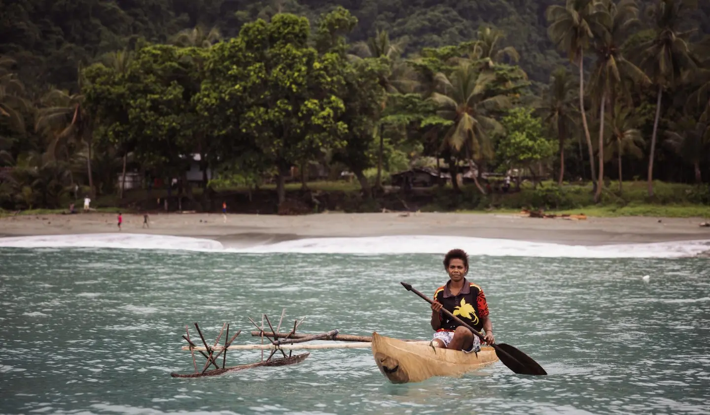 Angela, 19, fishes near her coastal community in East Sepik, Papua New Guinea