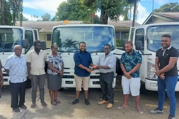 Health PS, Mrs. McNeil next to Central Islands Provincial Health Director Dr Leslie Bunabo who received key to one of the 3 tonne trucks from MHMS Deputy Secretary Dr Gregory Jilini along-side World Bank and MHMS staff.