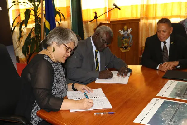 Hon. Prime Minister and the New Zealand High Commissioner at the signing ceremony, witnessed by the Minister for Aviation, Hon. Shanel.