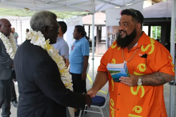 Prime Minister Manasseh Sogavare being greeted by a Tourism Solomons staff at the launching of the campaign.