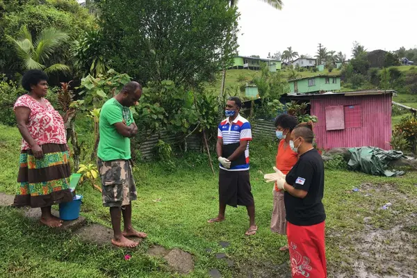 Caption: Social Empowerment and Education Programme (SEEP) staff raising awareness on COVID-19 in communities.
