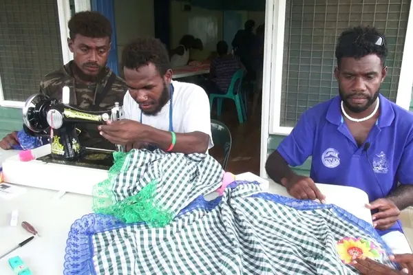 Henry, Rex and Patterson at the sewing class facilitated by the Guadalcanal Provincial Council of Women.